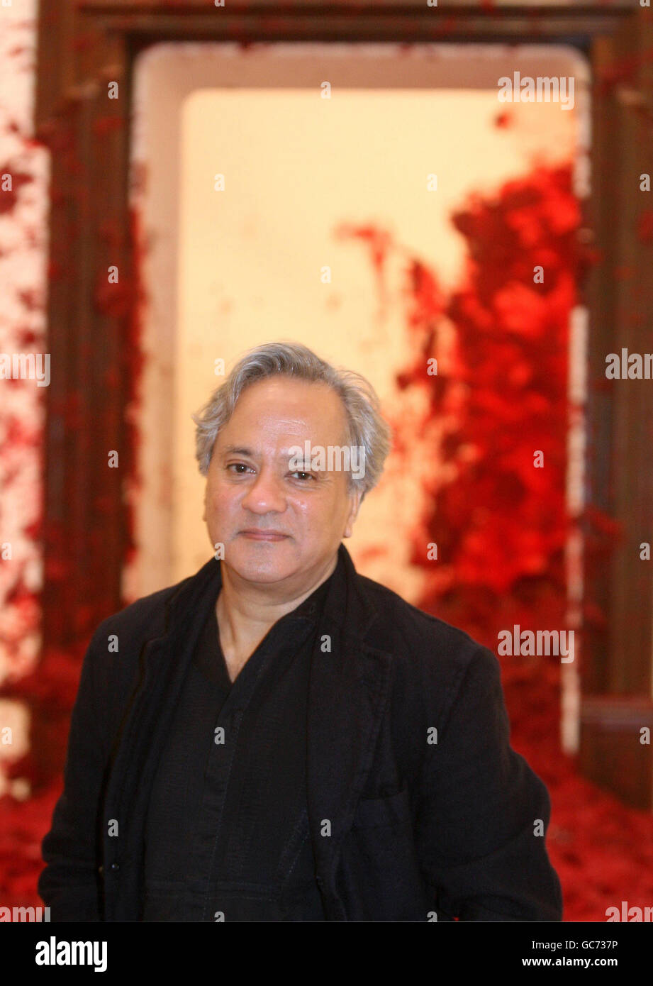 Photo call with Anish Kapoor and his major work, Shooting into the Corner, which has fired red wax at the Royal Academy's walls every twenty minutes during his solo exhibition since September 26th. The exhibition will run midnight on Friday December 11th at the Royal Academy of Arts, London. Stock Photo