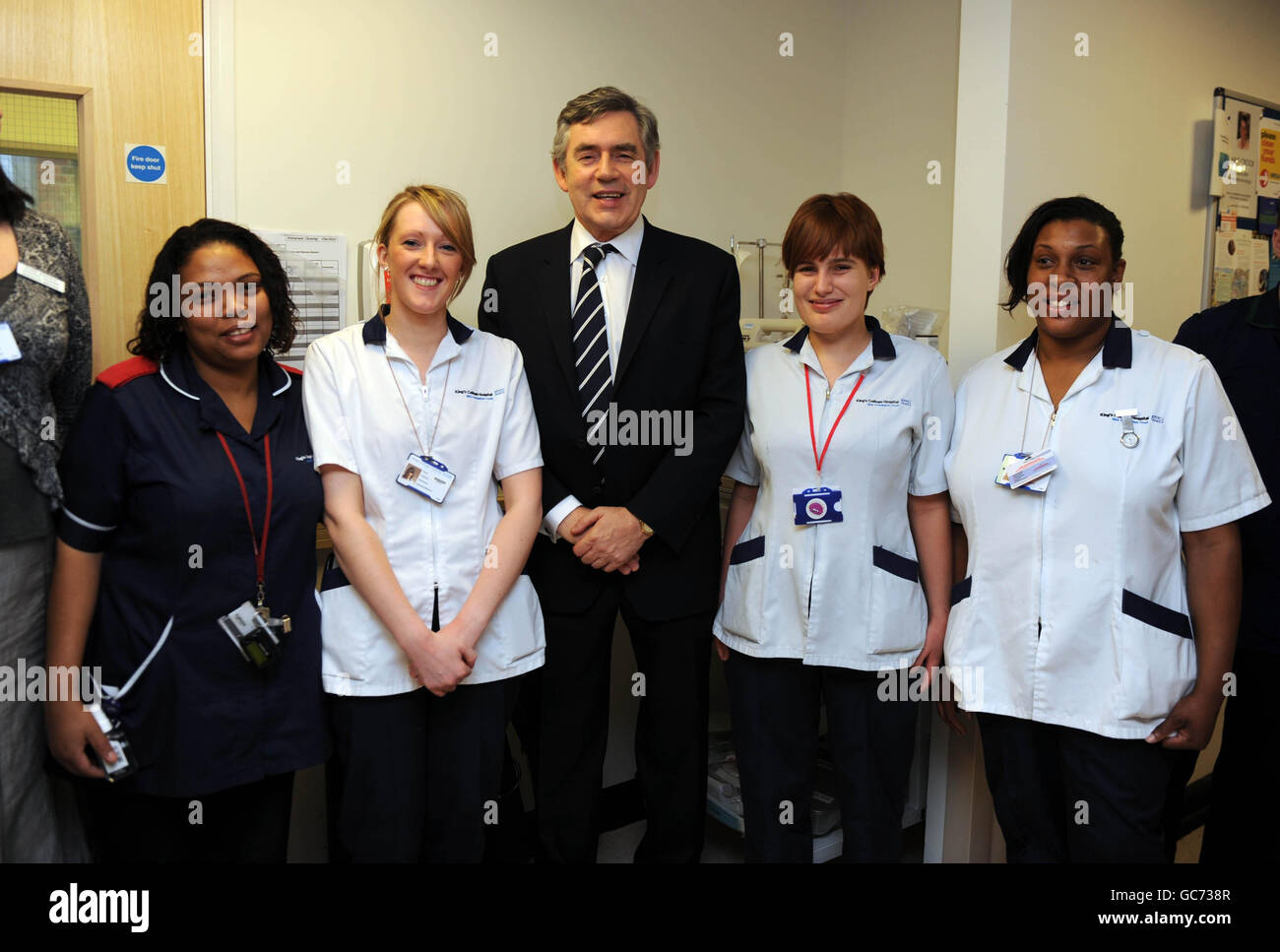 Gordon Brown stands with nurses during a visit to Kings College Hospital, Denmark Hill, London. Stock Photo