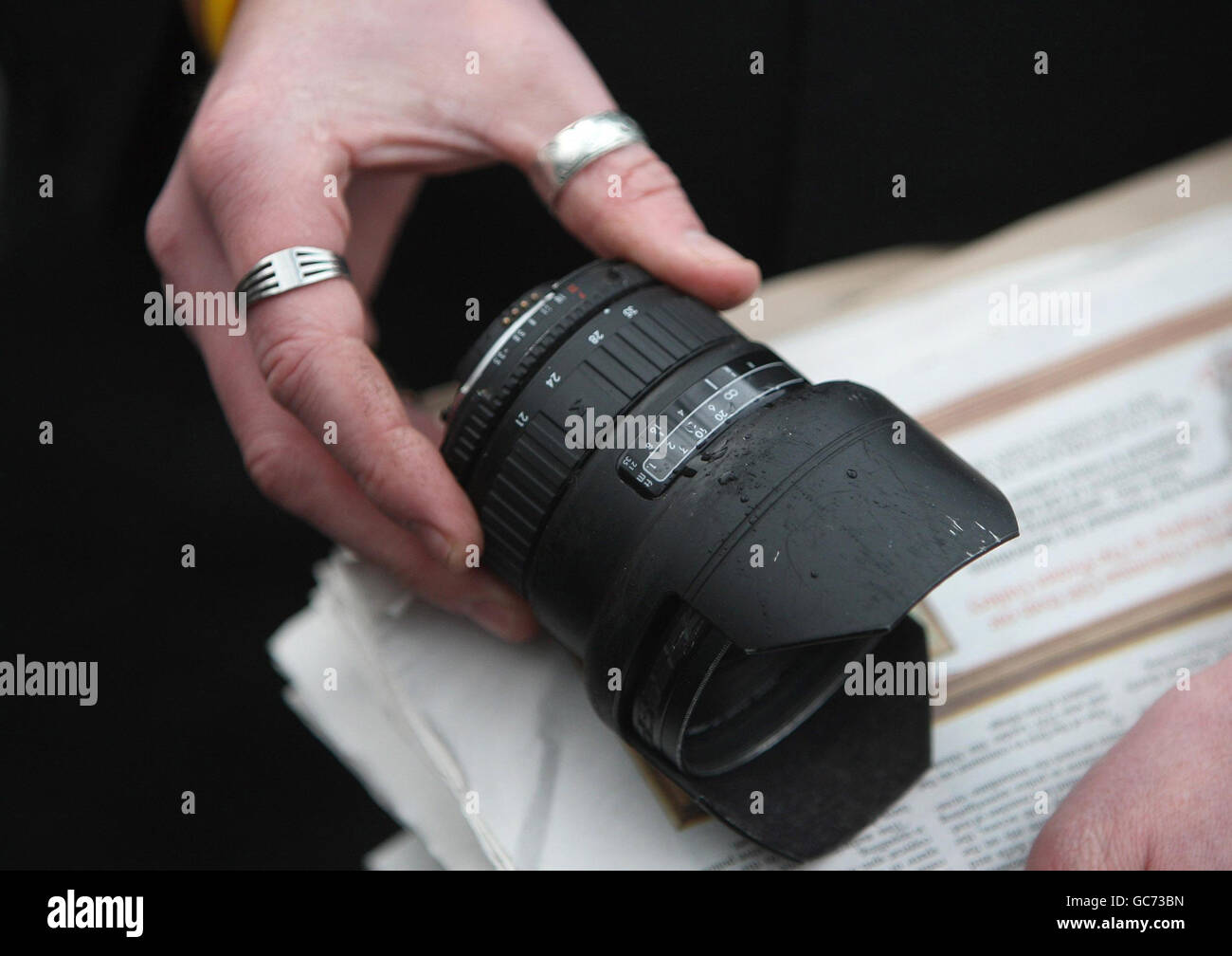 Freelance photographer Hugo McNiece shows his damaged lens to the media outside Ballymena Magistrates' Court where Eighties pop singer Shakin' Stevens is appearing charged with assaulting him. Stock Photo