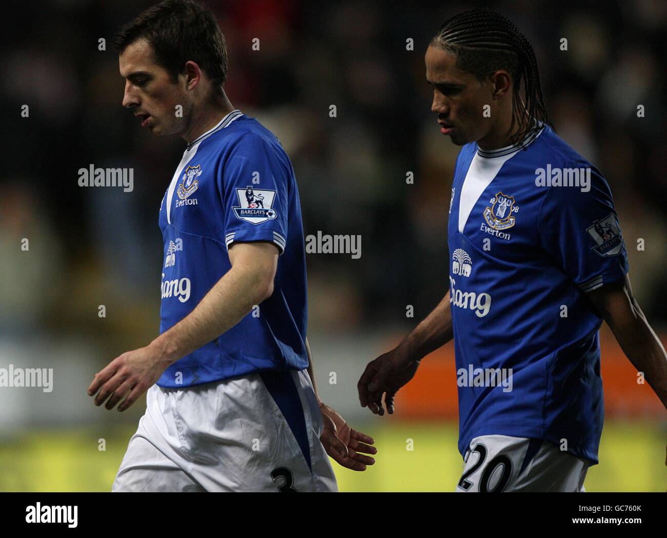 Everton Leighton Baines (left) and Steven Pienaar walk off the field of play dejected at half time Stock Photo