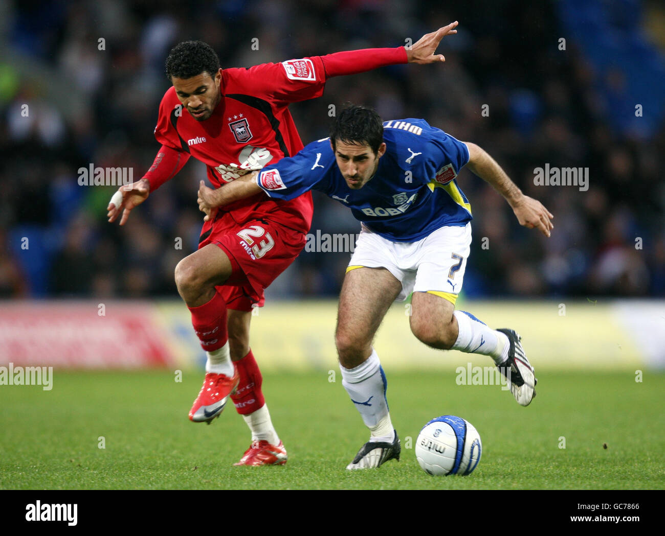Cardiff's Peter Whittingham holds off the challenge of Ipswich's Carlos  Edwards during the Coca-Cola Championship match at Cardiff City Stadium,  Cardiff Stock Photo - Alamy