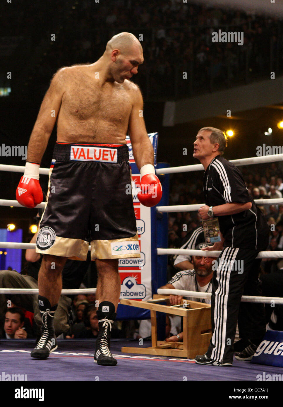 Russia's Nikolai Valuev talks to his trainer as he gets up from his corner of ring at the Nuremberg Arena, Germany Stock Photo