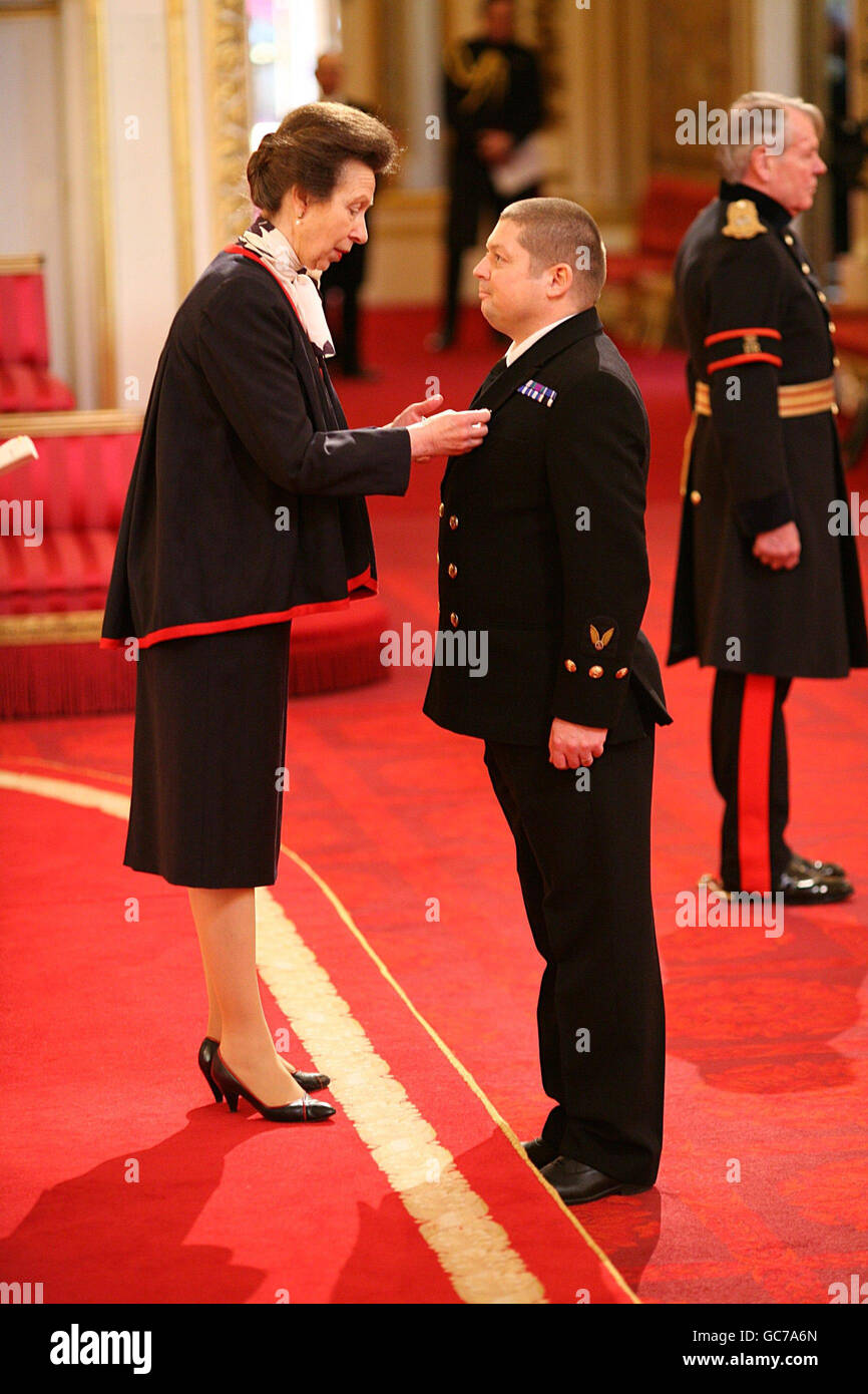 Chief Petty Officer Aircrewman David Rigg receives The Queen's Gallantry Medal from the Princess Royal during investitures at Buckingham Palace in London. Stock Photo