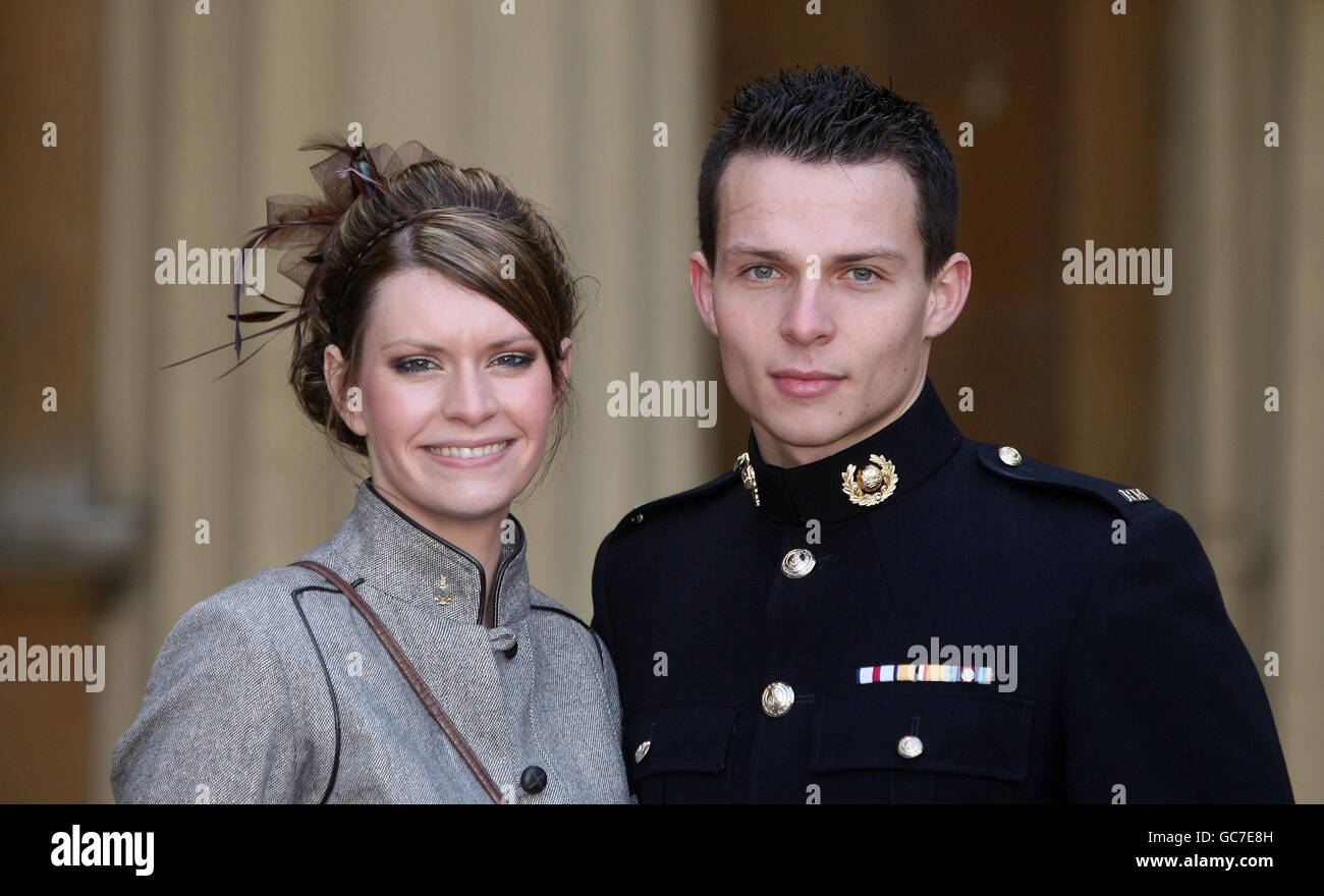 Acting Corporal Bradley Malone, Royal Marines, who received the Conspicuous Gallantry Cross for his bravery in Afghanistan with his fiancee Sacha Wilkinson who accepted his marriage proposal today after he received his award at Buckingham Palace. Stock Photo