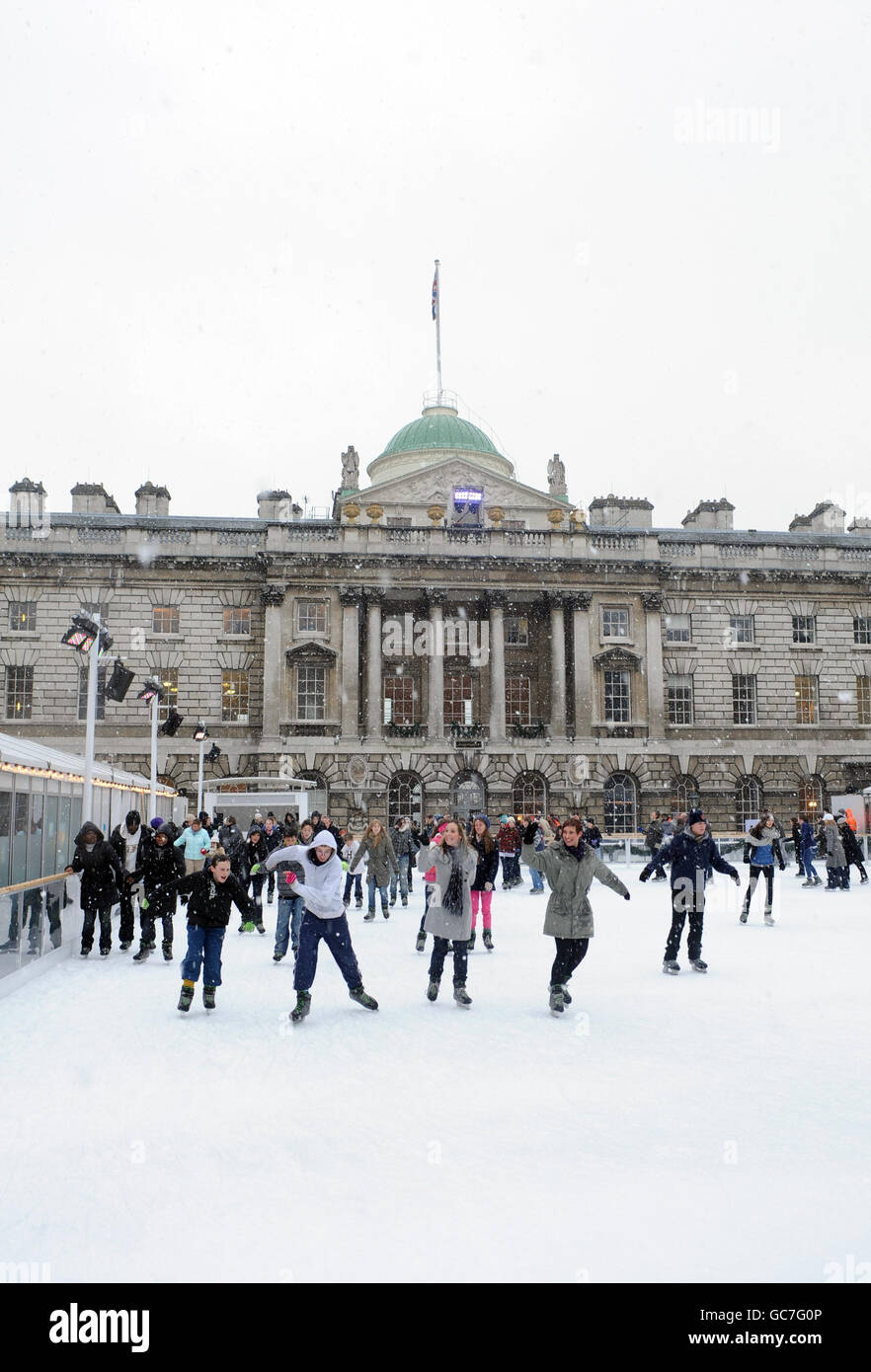 Skaters enjoy the winter weather at Somerset House Ice Rink as snow ...