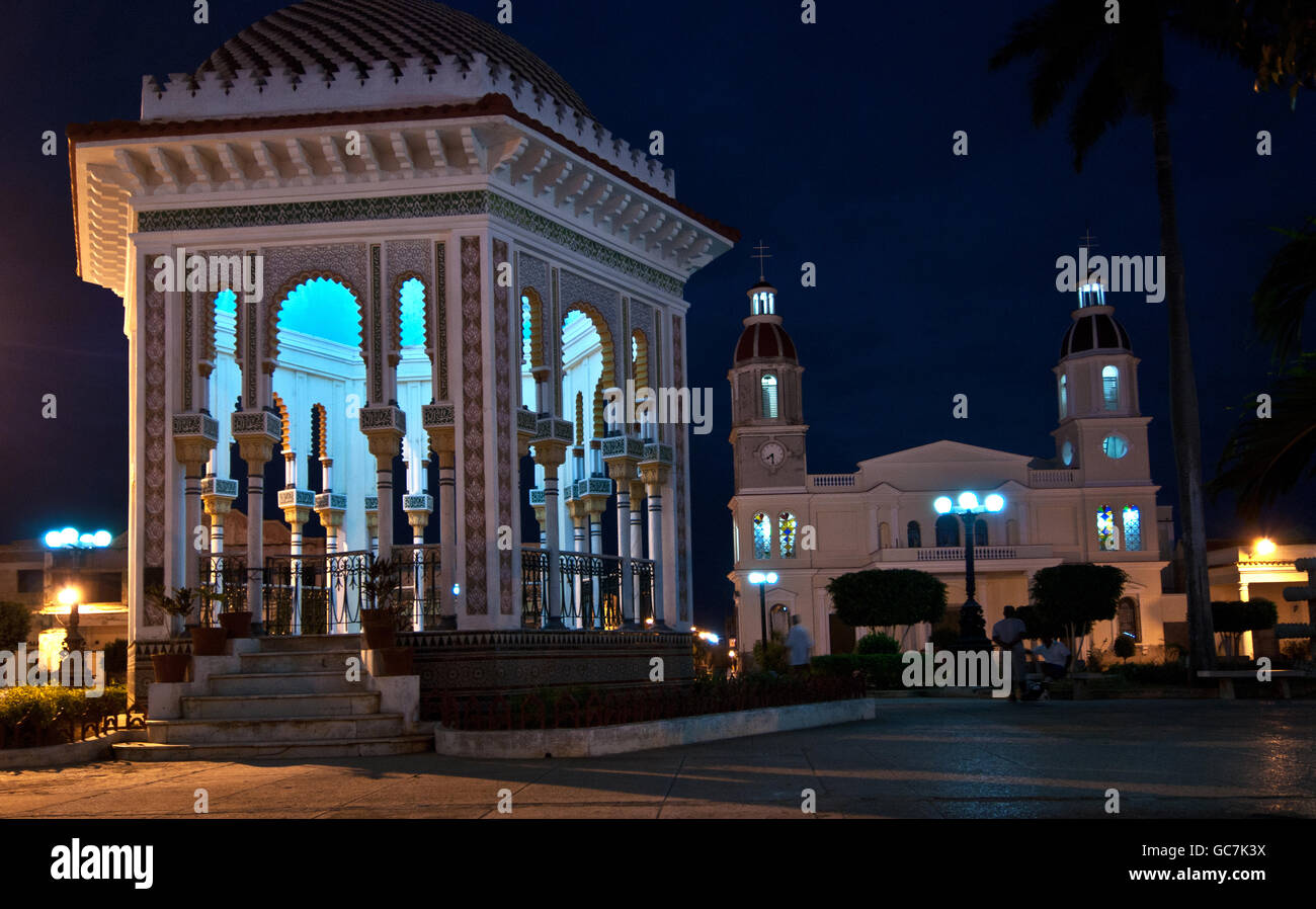 Glorieta de Manzanillo, Parque Carlos Manuel de Céspedes with church, night, town Manzanilo, Cuba Stock Photo