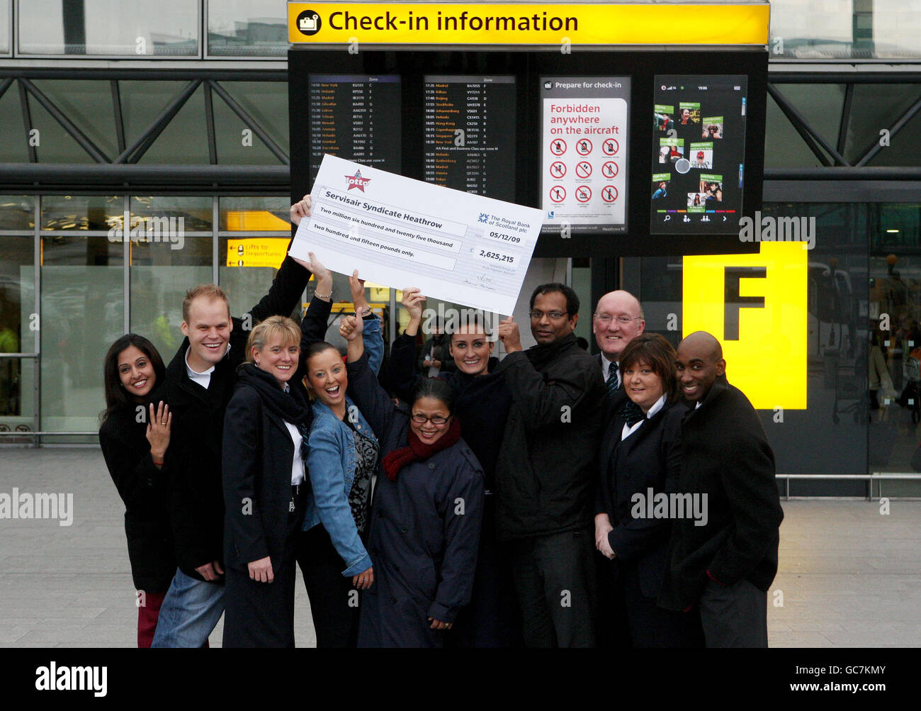 Some of the 23-strong syndicate of check-in staff at Heathrow Airport Terminal 3, who won 2.6m in the Lotto draw. Stock Photo