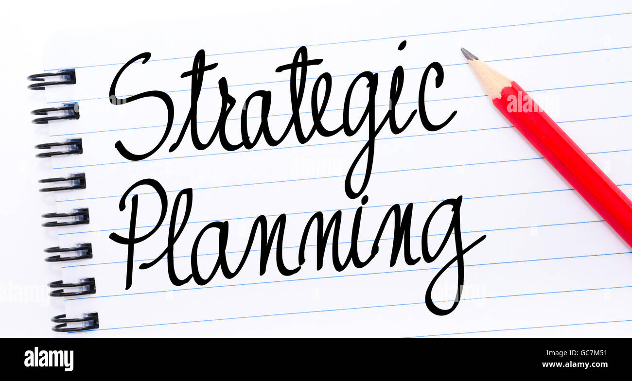 Strategic Planning written on notebook page with red pencil on the right Stock Photo