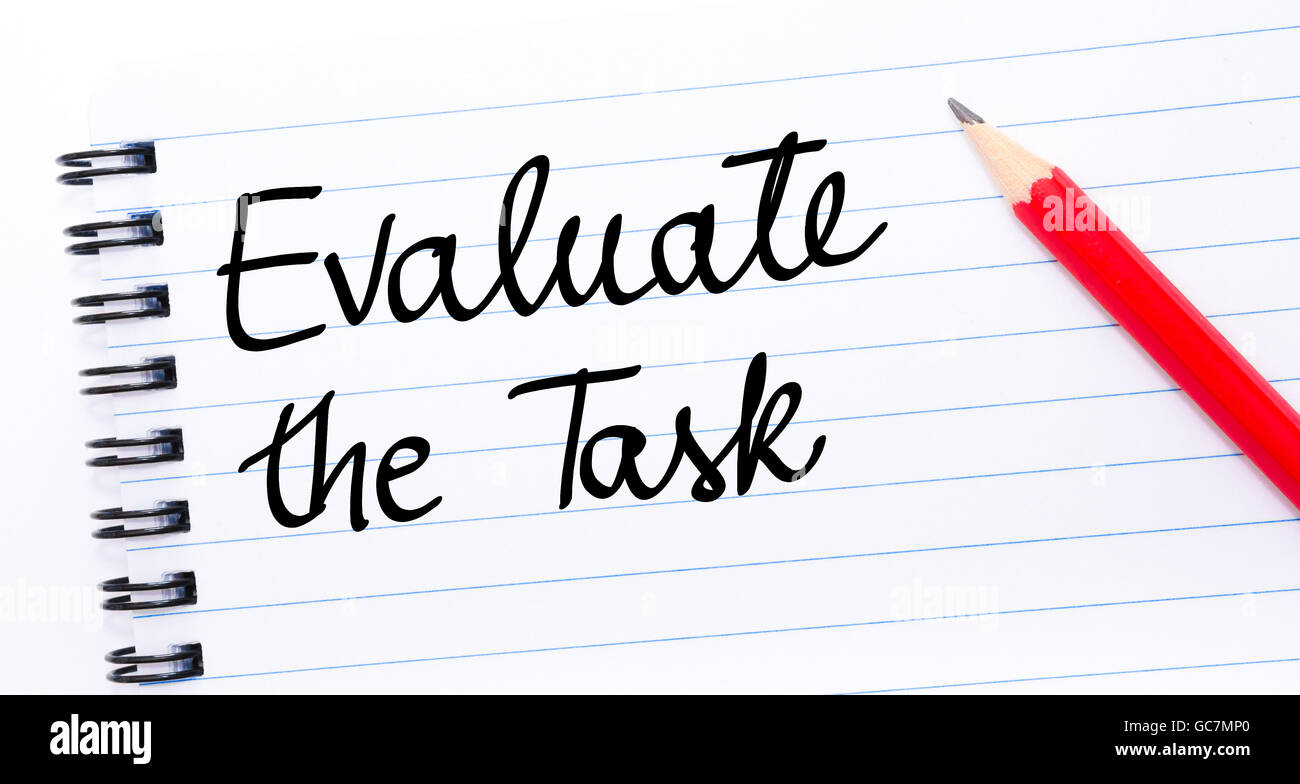 Evaluate the Task written on notebook page with red pencil on the right Stock Photo