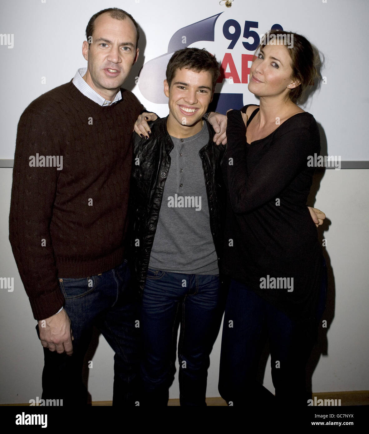 X Factor winner Joe McElderry (centre) meets Johnny Vaughan (left) and Lisa Snowdon (right) as he visits Capital FM at Global Radio Studios in Leicester Square, central London. Stock Photo