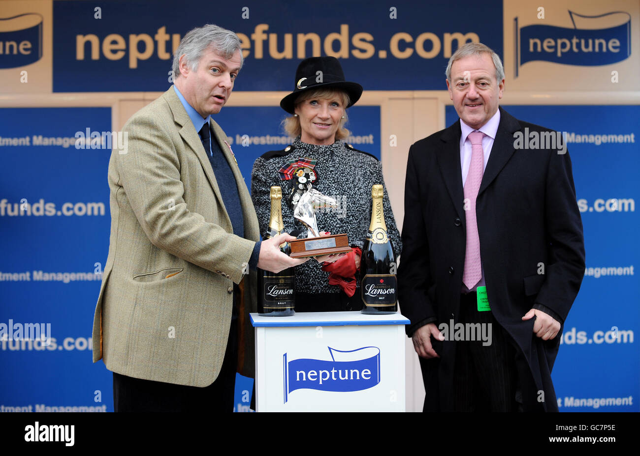 Neptune Investment Managing Director Robin Geffen (left) and Owner David Johnson (right) celebrate with the The Neptune Investment Management Steeple Chase (Handicap) award after their horse The Package ridden by jockey Timmy Murphy wins the race Stock Photo