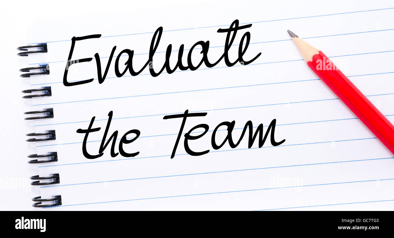 Evaluate The Team written on notebook page with red pencil on the right Stock Photo