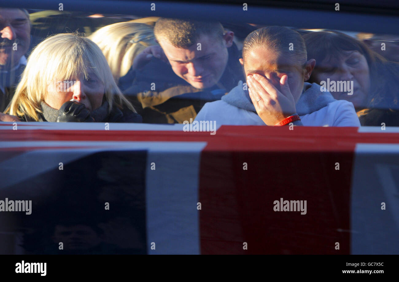 Friends and family members of Lance Corporal David Kirkness, 24 of 3rd Battalion The Rifles, cry as his coffin stops in Wootton Bassett in Wiltshire after being repatriated from Afghanistan, along with the bodies of Rifleman James Brown, 18 of 3rd Battalion The Rifles and Corporal Simon Hornby, 29, of 2nd Battalion The Duke of Lancaster's Regiment. Stock Photo