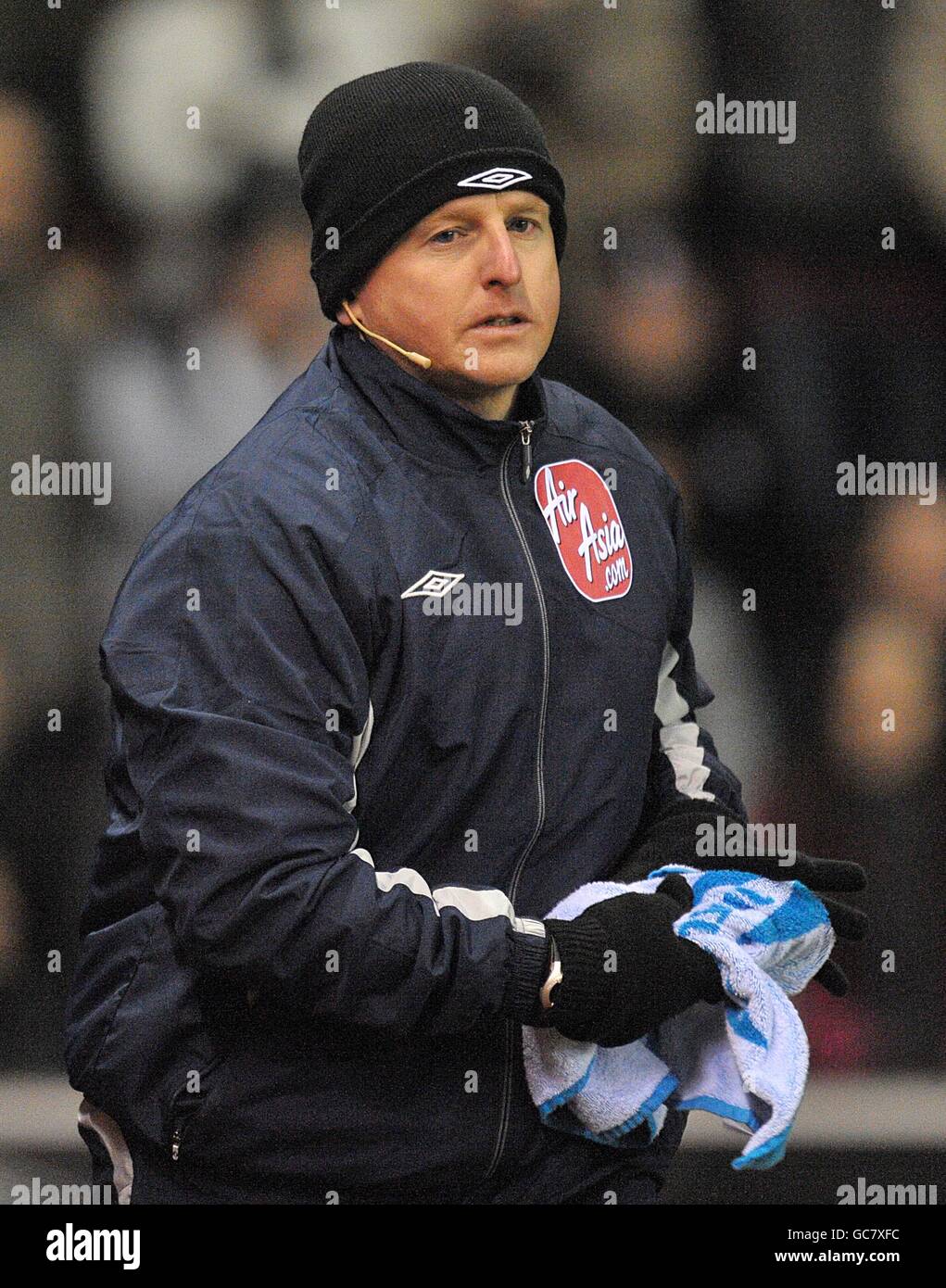 Soccer - Barclays Premier League - Stoke City v Birmingham City - Britannia Stadium. The fourth official removes the towels from around the pitch Stock Photo