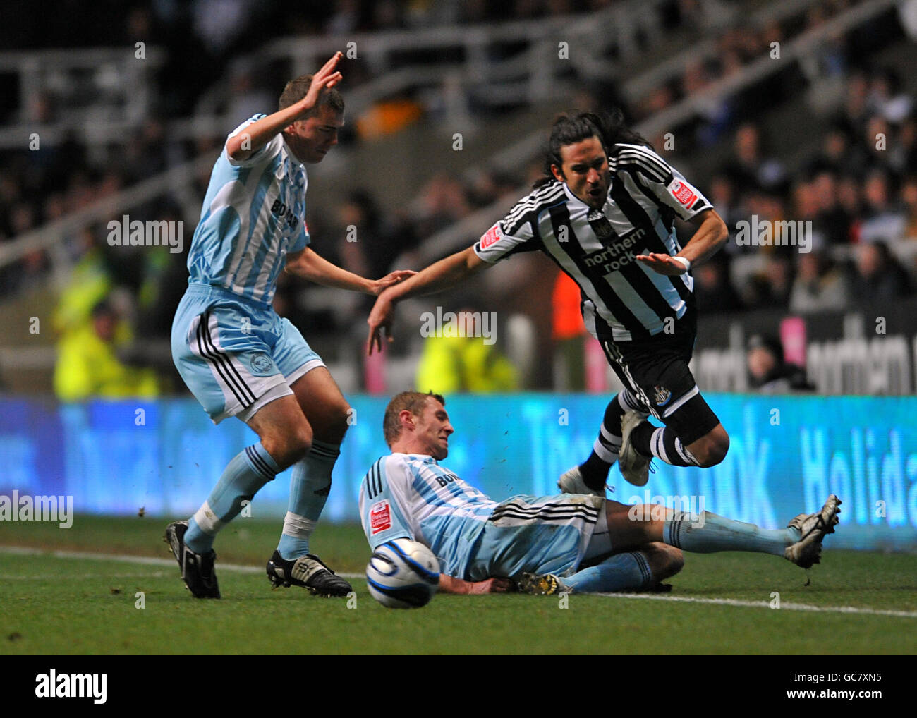 Newcastle United's Jonas Gutierrez is fouled by Derby County's Rob Hulse during the Coca-Cola Championship match at St James' Park, Newcastle. Stock Photo