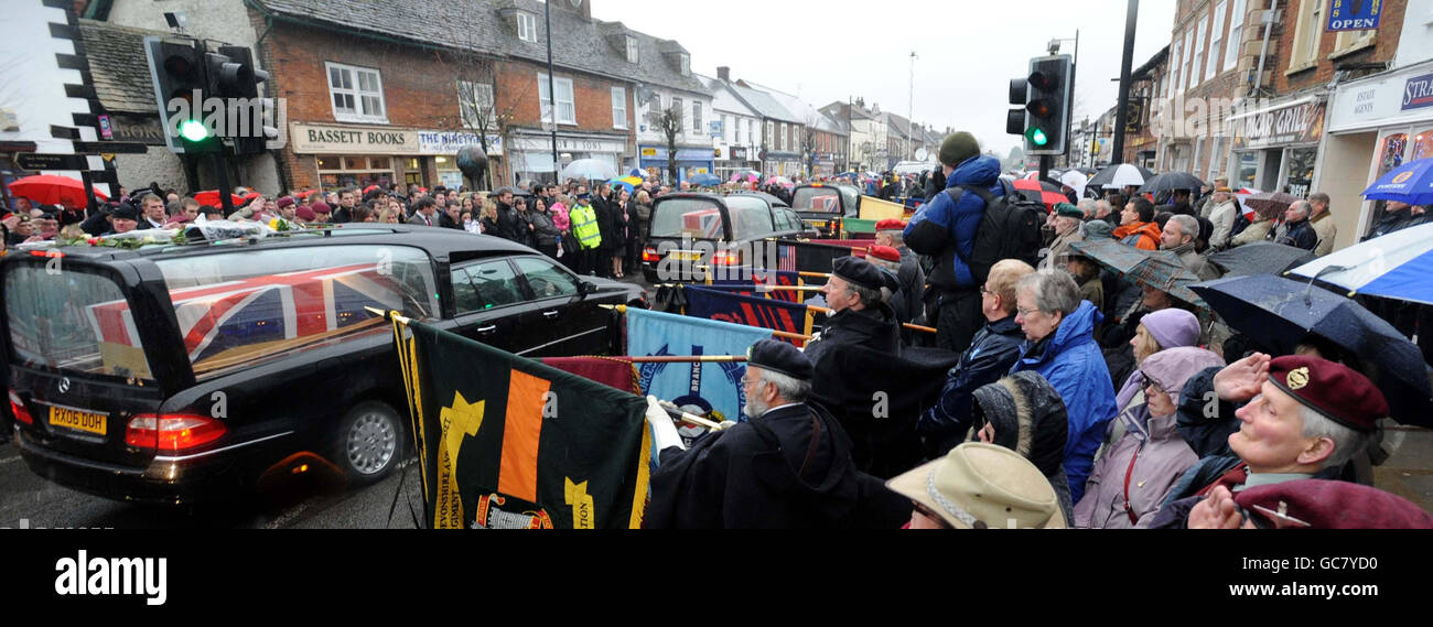 Mourners gather to pay their respects as three hearses containing the bodies of Lance Corporal Michael Pritchard, 22, of the 4th Regiment, Royal Military Police, Lance Corporal Christopher Roney, 23, of 3rd Battalion The Rifles and Lance Corporal Tommy Brown, of the Parachute Regiment, are carried through the streets of Wootton Bassett during their repatriation to the UK. Stock Photo