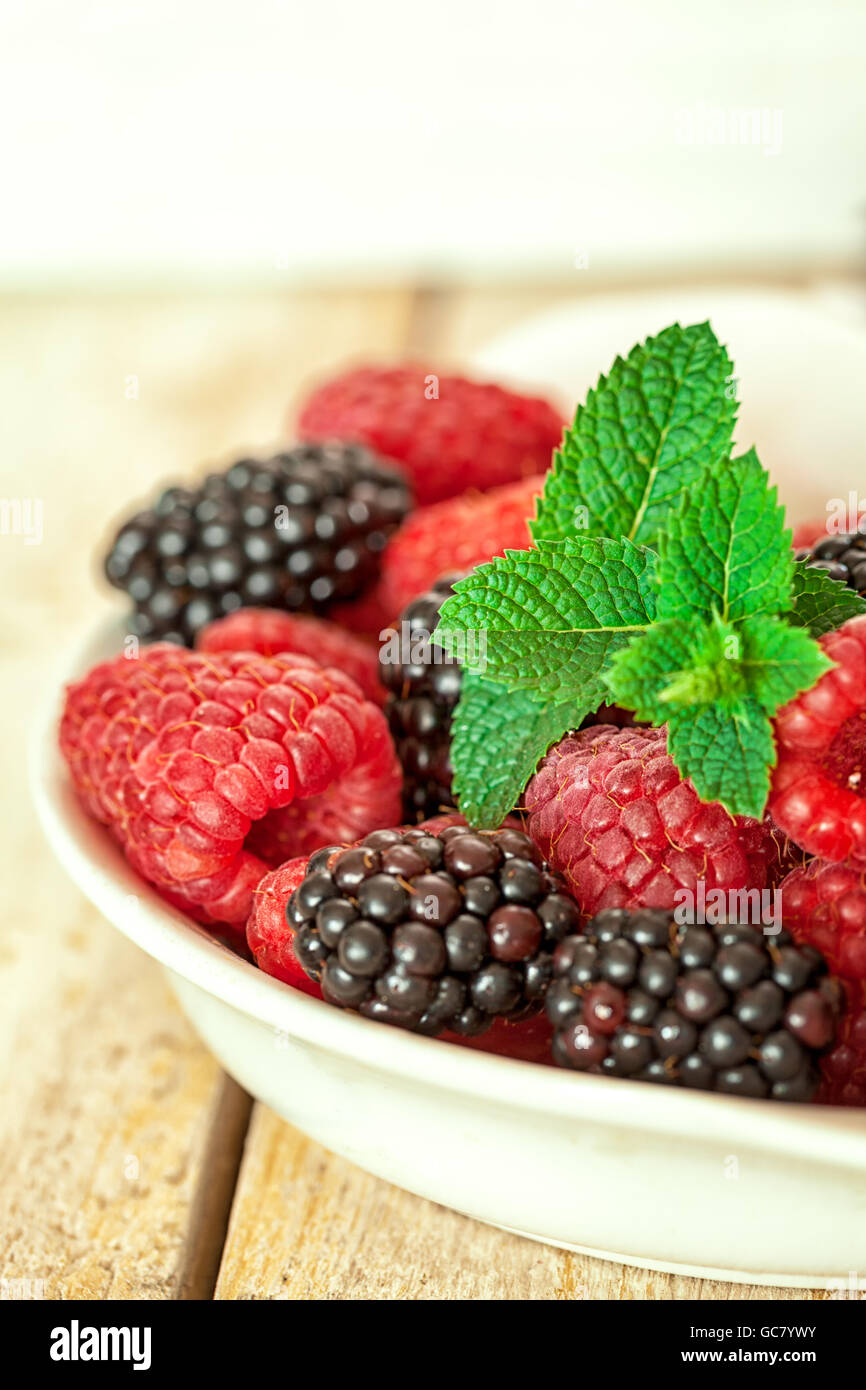 Mixed berries raspberries and blackberries Stock Photo Alamy