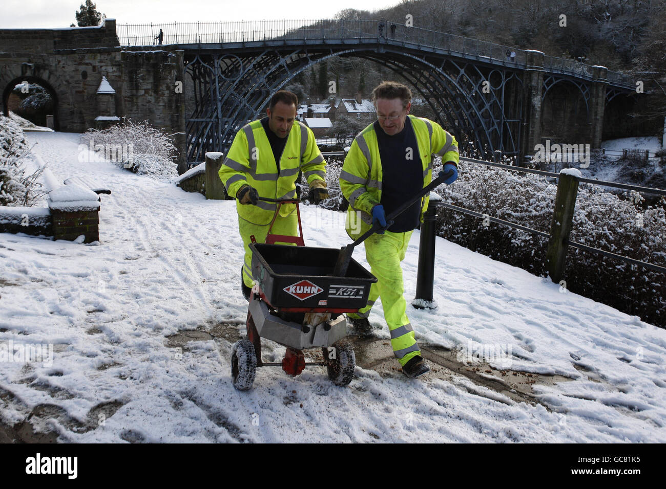 Telford and Wrekin council workers grit the pavements in Ironbridge, Shropshire as heavy snowfall continues across most parts of the UK. Stock Photo