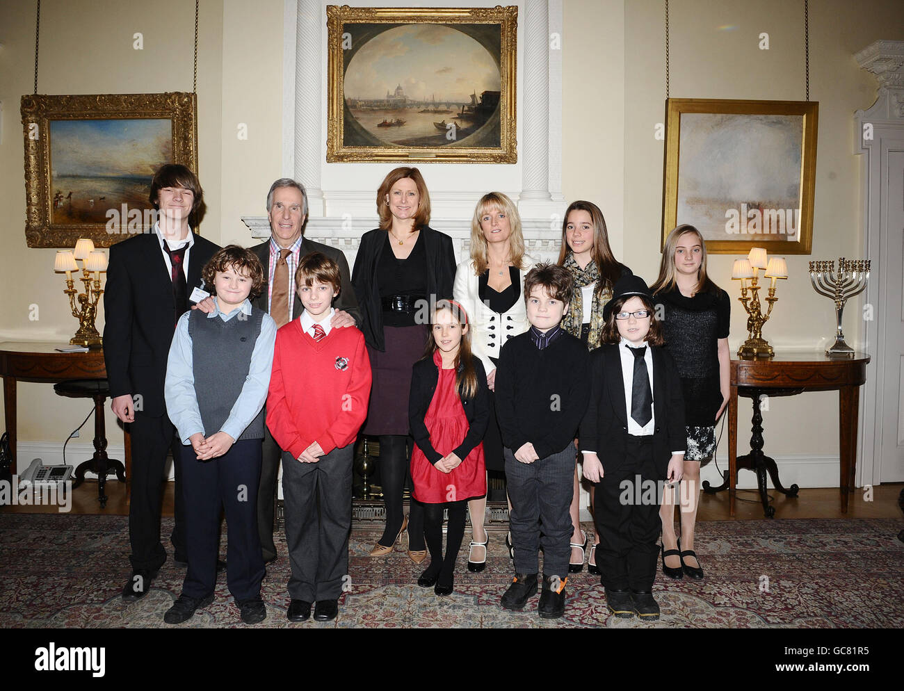 (Back row, left to right) Barney Cox, Henry Winkler, Sarah Brown, Nicky Cox, Bethany Cox, Daisy Cox (front row, left to right) Ben Hunter, Ryan King, Liberty Cox, Isaac Lyons and Evie Lyons pose for a photograph at the launch of the First News My Way! campaign, a scheme to help children with special educational needs, in Downing Street, London. Stock Photo