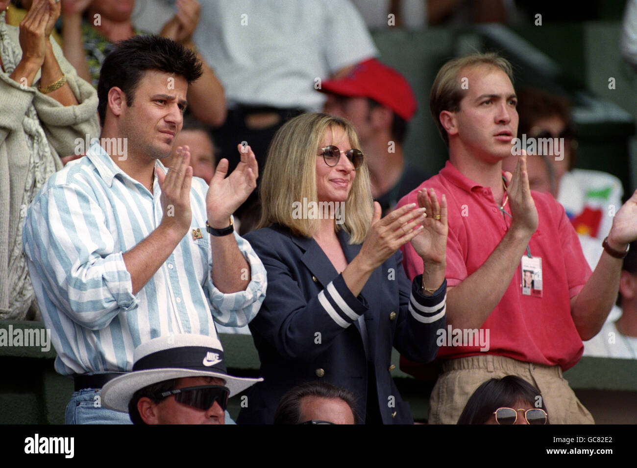 Barbra Streisand APPLAUDS ANDRE AGASSI ALONG WITH HIS BROTHER, PHILLIP (L)  AND AN UNIDENTIFIED MAN, DURING AGASSI'S QUARTER FINAL AGAINST PETE SAMPRAS  Stock Photo - Alamy