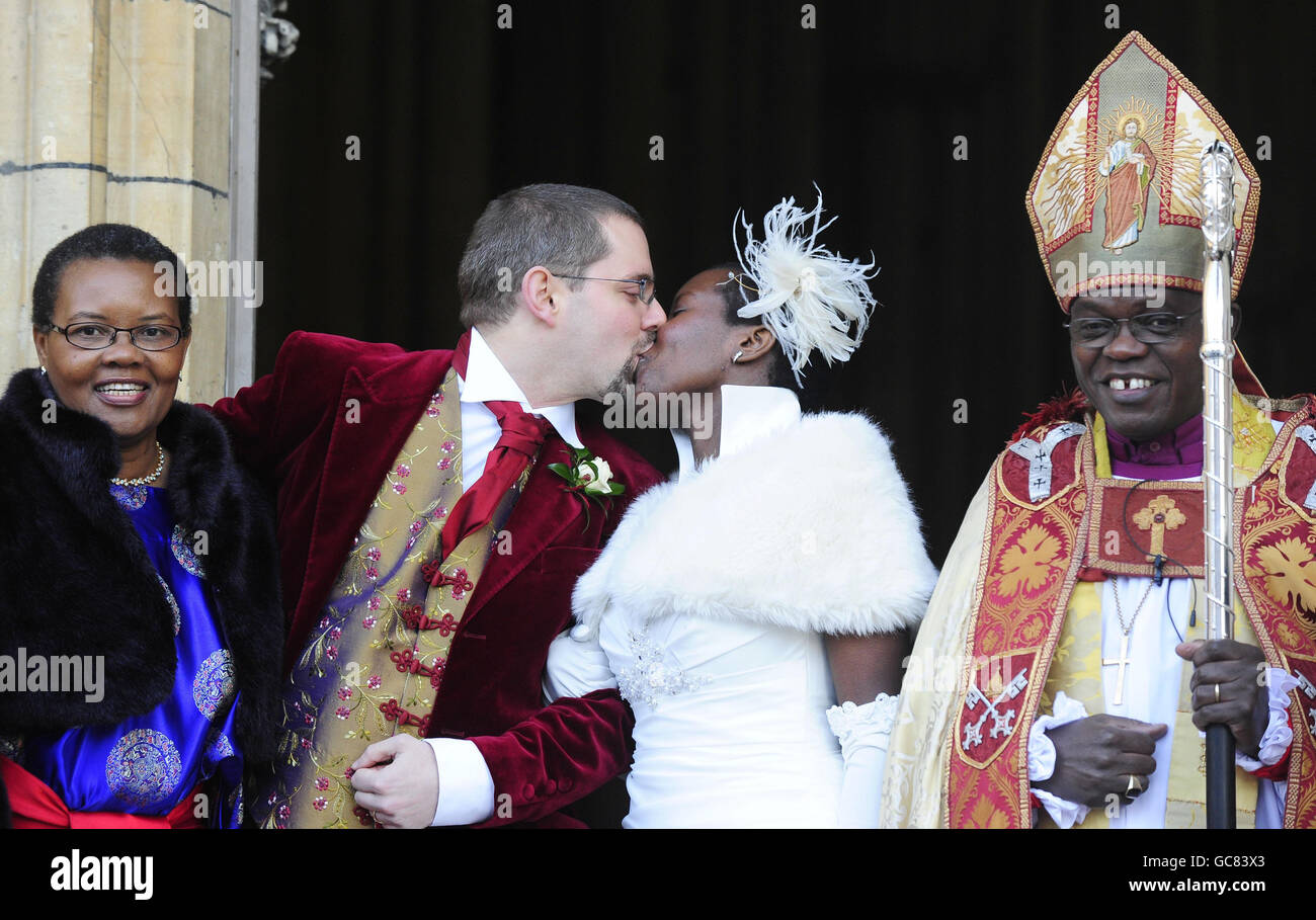 The Archbishop of York Dr John Sentamu and his wife Margaret (left) with their daughter Grace after her wedding to Timothy Baverstock at York Minster. Stock Photo