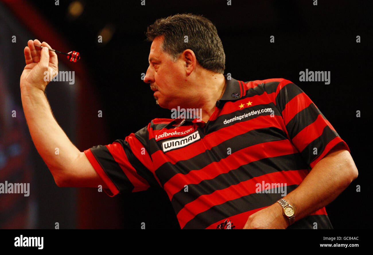 Dennis Priestley in action against Kevin McDine during the Ladbrokes.com  World Darts Championship at the Alexandra Palace, London Stock Photo - Alamy