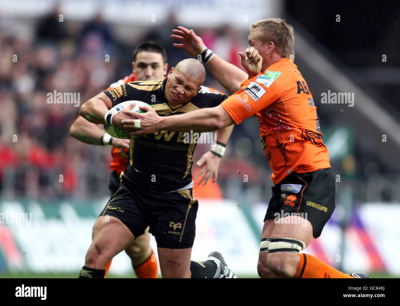 Ospreys' Ricky Januarie is tackled by Viadana's Sean Hohneck during the Heineken Cup Group match at The Liberty Stadium, Swansea. Stock Photo