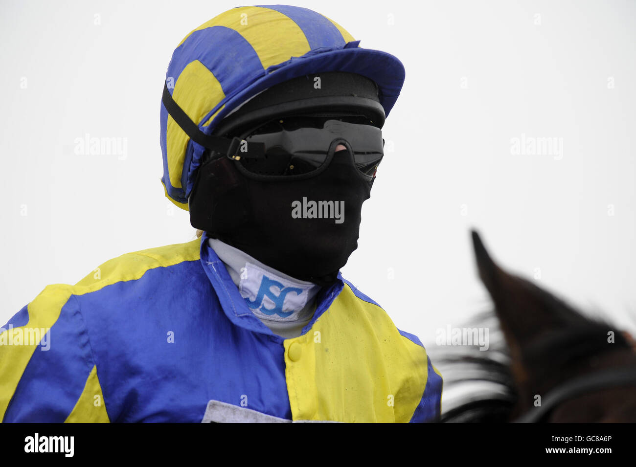 Horse Racing - Lingfield Racecourse. Jockey Hayley Turner wears faces protection at Lingfield Racecourse. Stock Photo