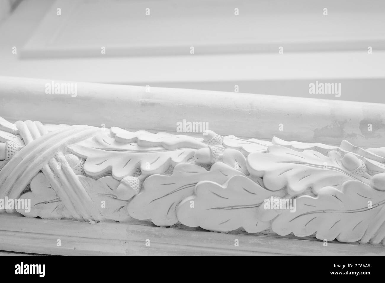 Beautiful elements of luxury wall design, white stucco mouldings over light background, antique plastering Stock Photo