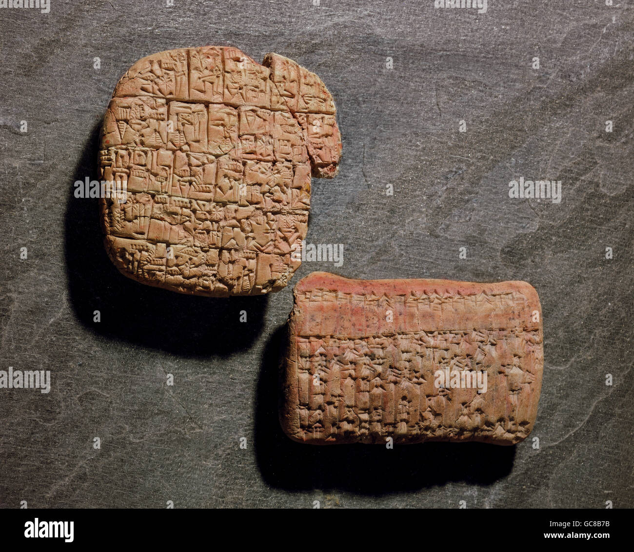 writing, scripture, cuneiform writing, right: school exercise from Abu Salabich, Sumerian, pre dynastic period, circa 2900 - 2680 BC, left: adminstration document from Karana, Assyrian, period of King Shamshi-Arad I, circa 1808 - 1776 BC, Iraqui National Museum, Bagdad, clay tablets, tablets, Mesopotamia, ancient world antiquity, Iraq, Shamshi - Arad, historic, historical, ancient world, Additional-Rights-Clearences-Not Available Stock Photo