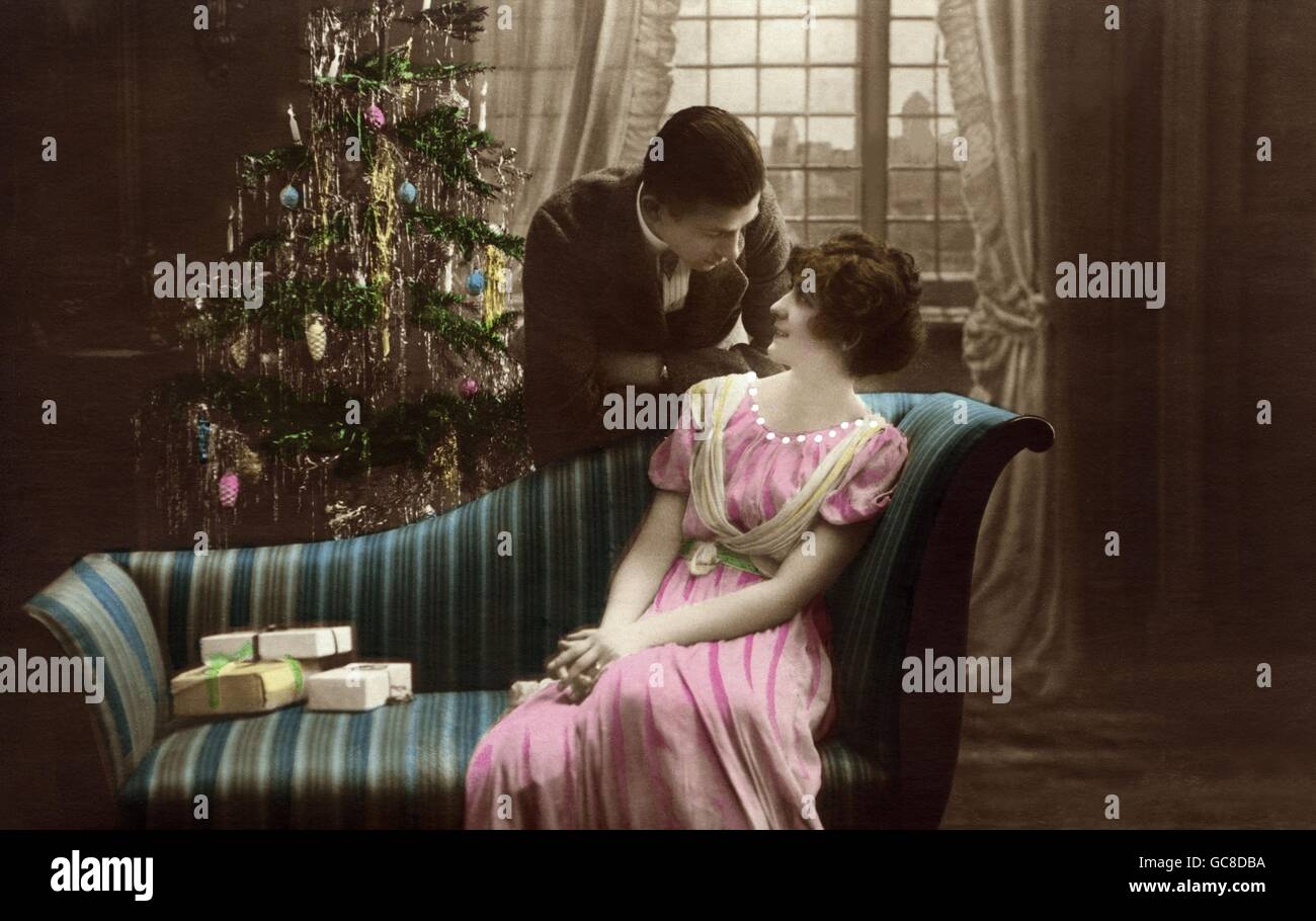 Christmas, Christmas Eve, couple under the Christmas tree, woman is sitting on the sofa, Germany, circa 1914, Additional-Rights-Clearences-Not Available Stock Photo