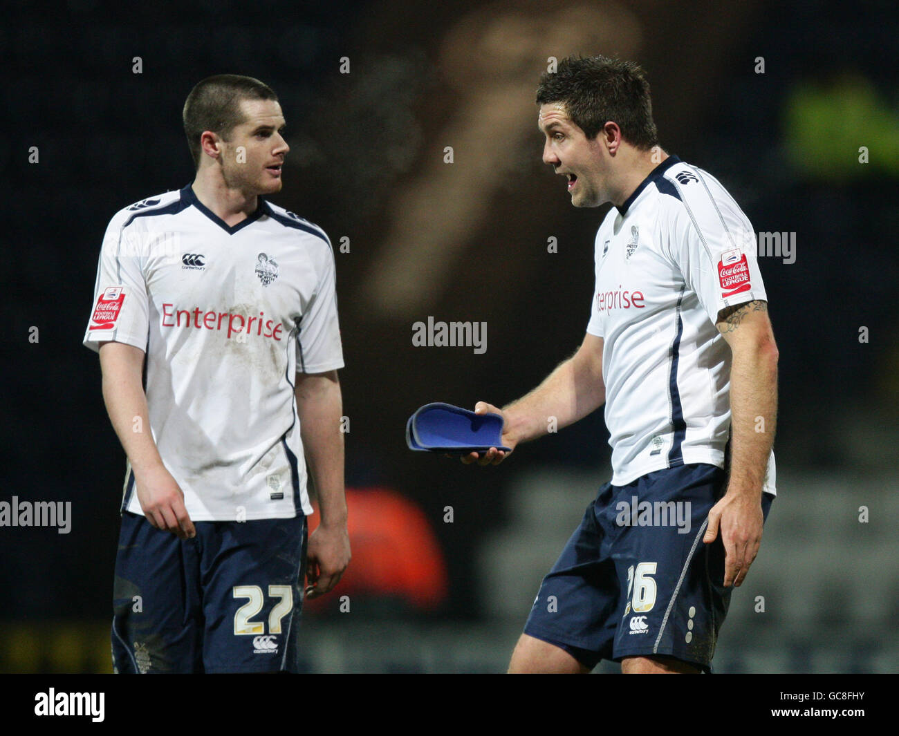 Soccer - Coca-Cola Football Championship - Preston North End v Barnsley - Deepdale. Preston North End's Eddie Nolan and Jon Parkin (right) argue after the final whistle following their 1-4 home defeat to Barnsley Stock Photo