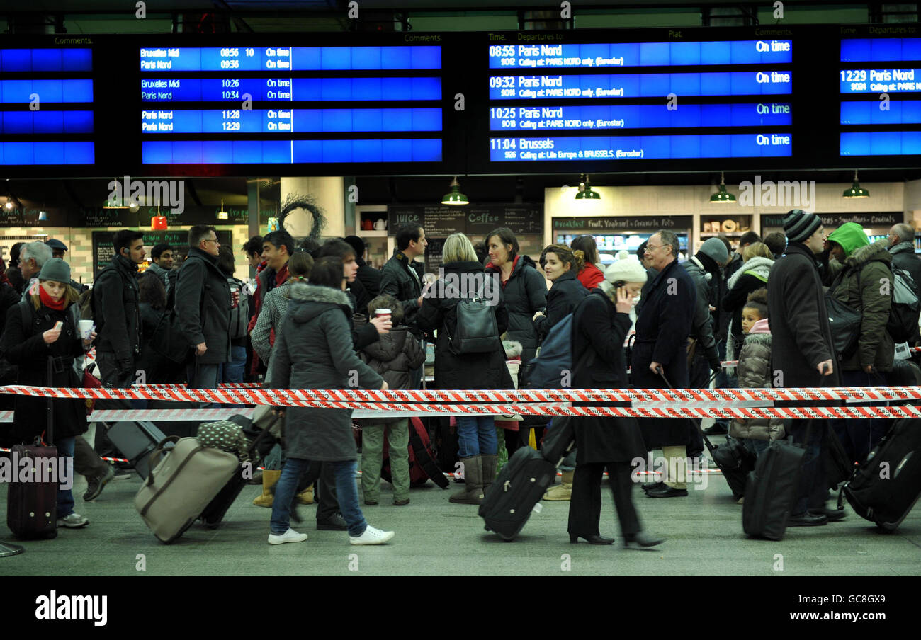 Passengers queue at St Pancras Station in London as Eurostar begin to resume normal service. Stock Photo