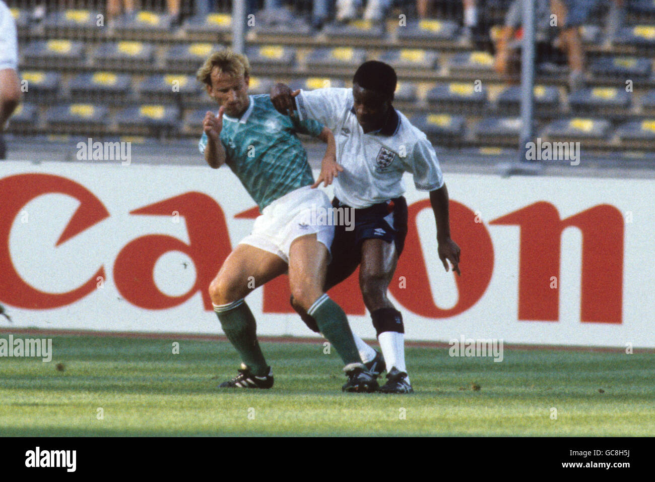 Soccer - FIFA World Cup Italia 90 - Semi-final - West Germany v England - Stadio Delle Alpi, Turin. England's Paul Parker (r) battles for the ball with West Germany's Andreas Brehme (l) Stock Photo