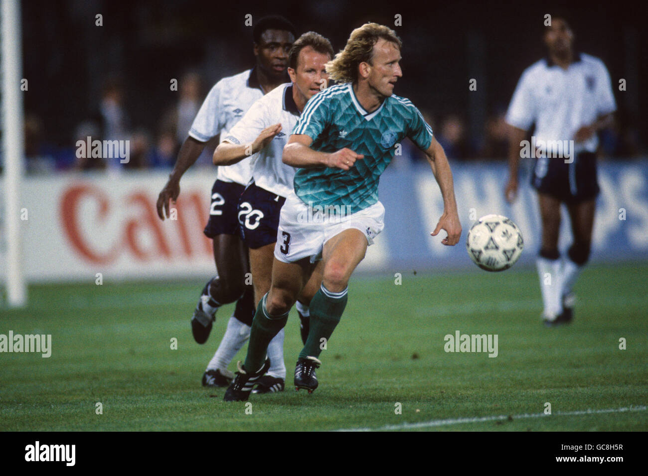 West Germany's Andreas Brehme gets away from England's Trevor Steven Stock Photo