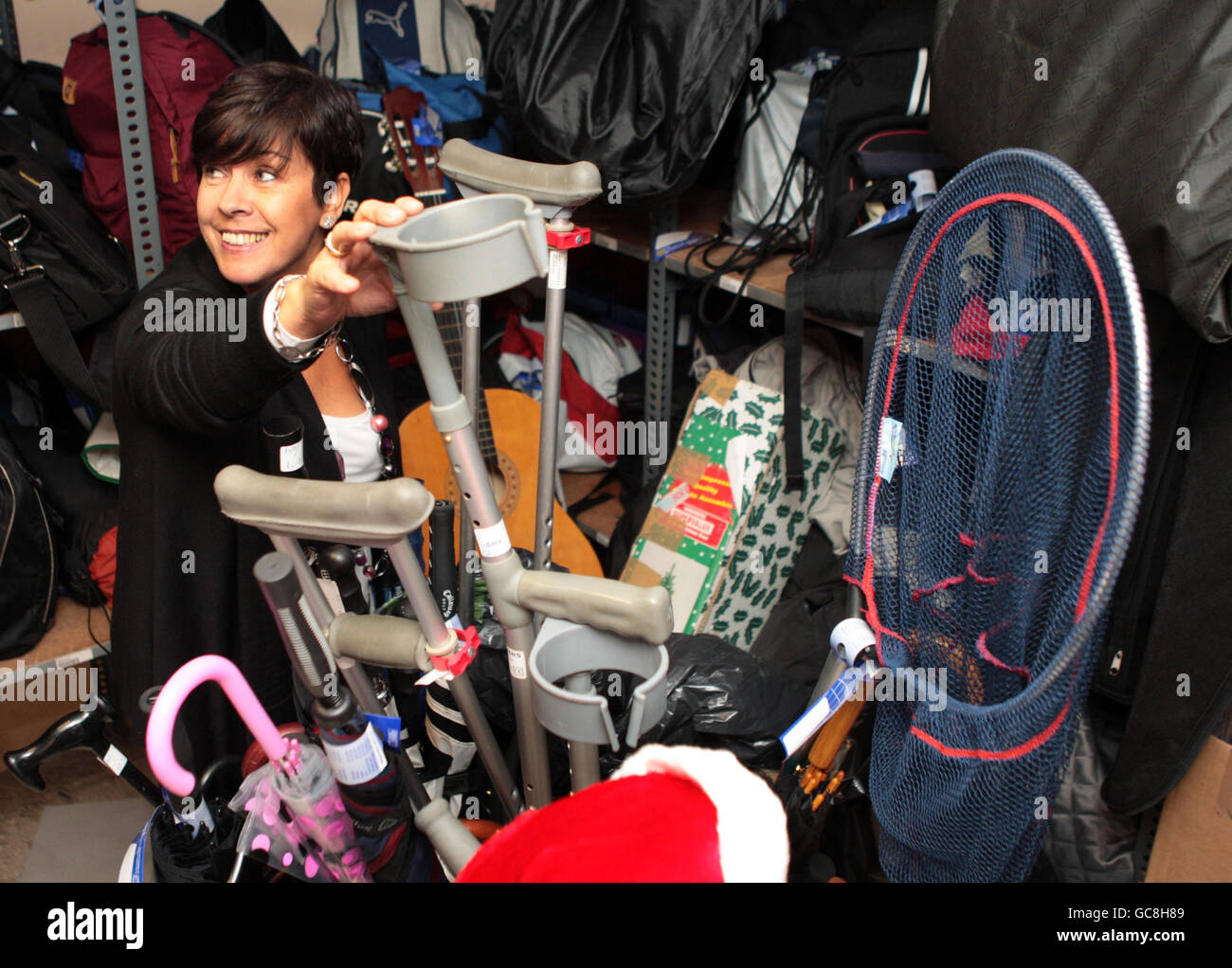 Beverley MacFall, manager of the lost property office, looks at some of