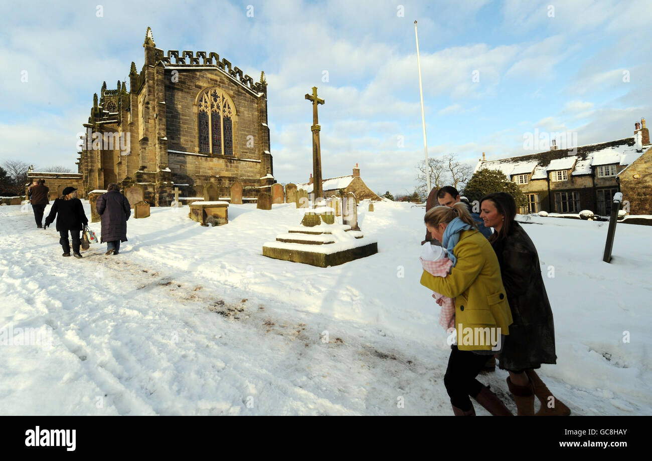 Christmas Day Church service at Coxwold in North Yorkshire where further snowfalls left the area with a White Christmas today. Stock Photo