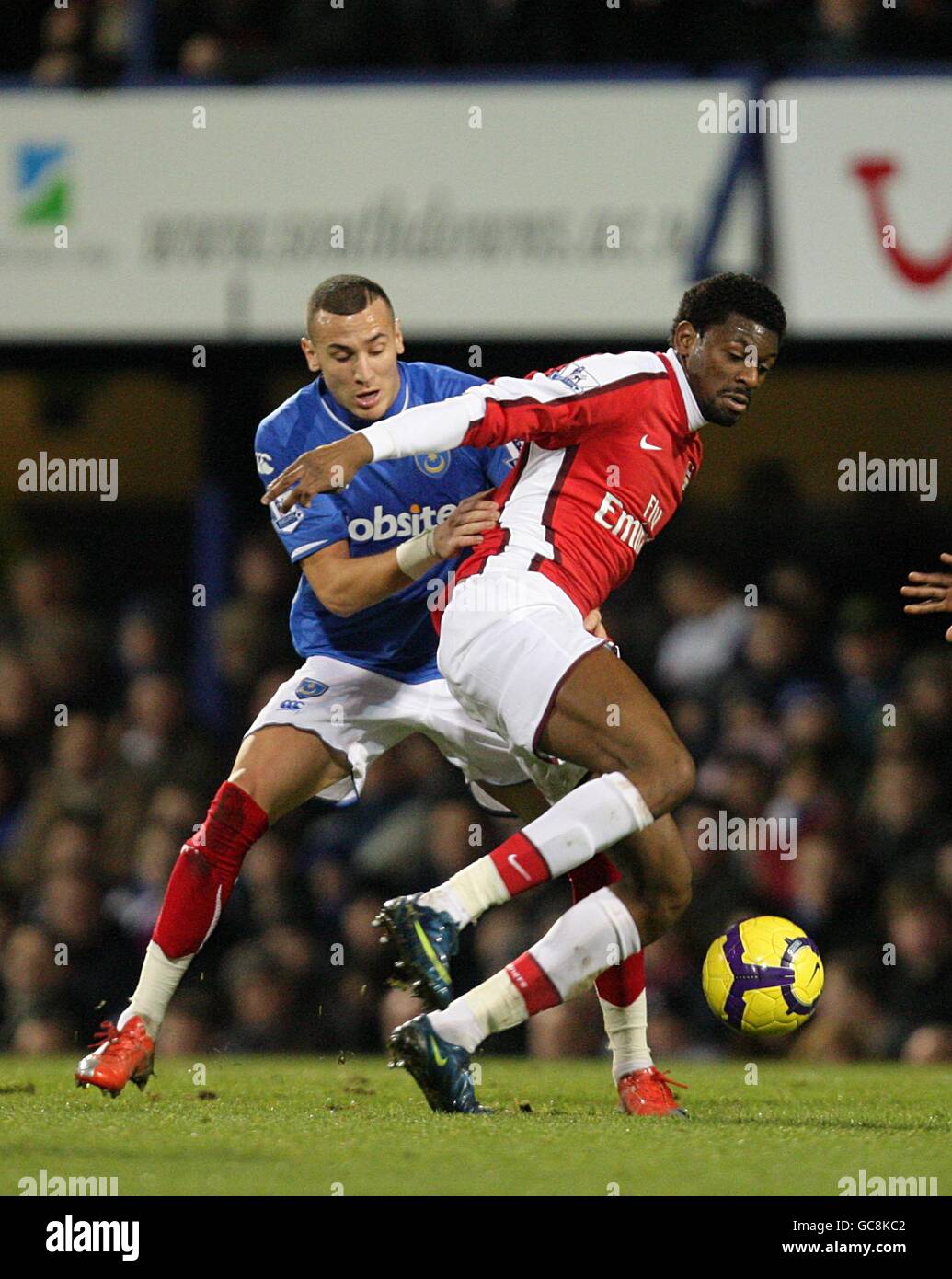 Soccer - Barclays Premier League - Portsmouth v Arsenal - Fratton Park. Portsmouth's Hassan Yebda (left) and Arsenal's Vassiriki Diaby (right) battle for the ball Stock Photo