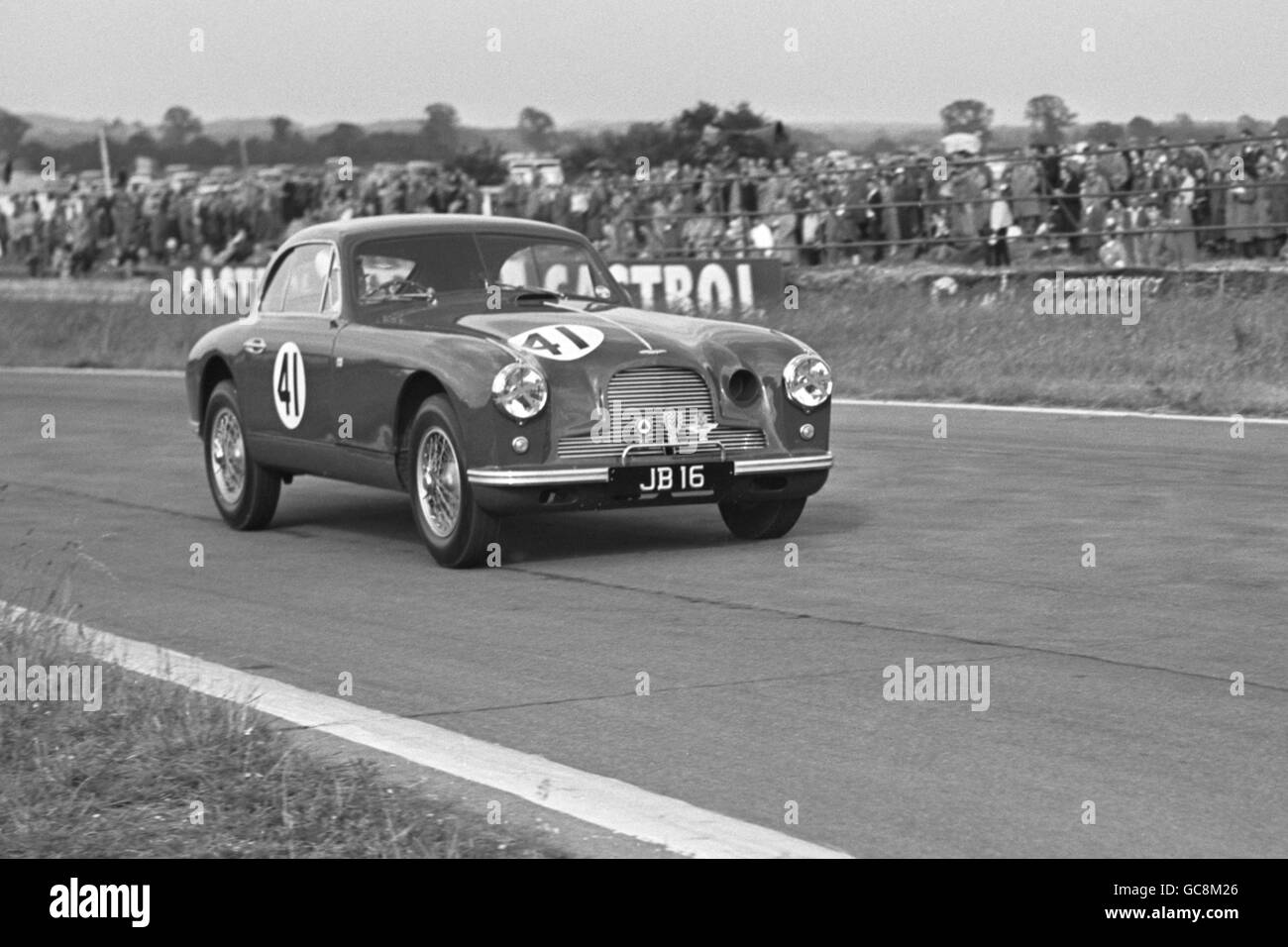 Mrs Jean Bloxham seen at speed in event 5 (Ladies five-lap handicap race) in her Aston Martin DB2. She came third. Stock Photo