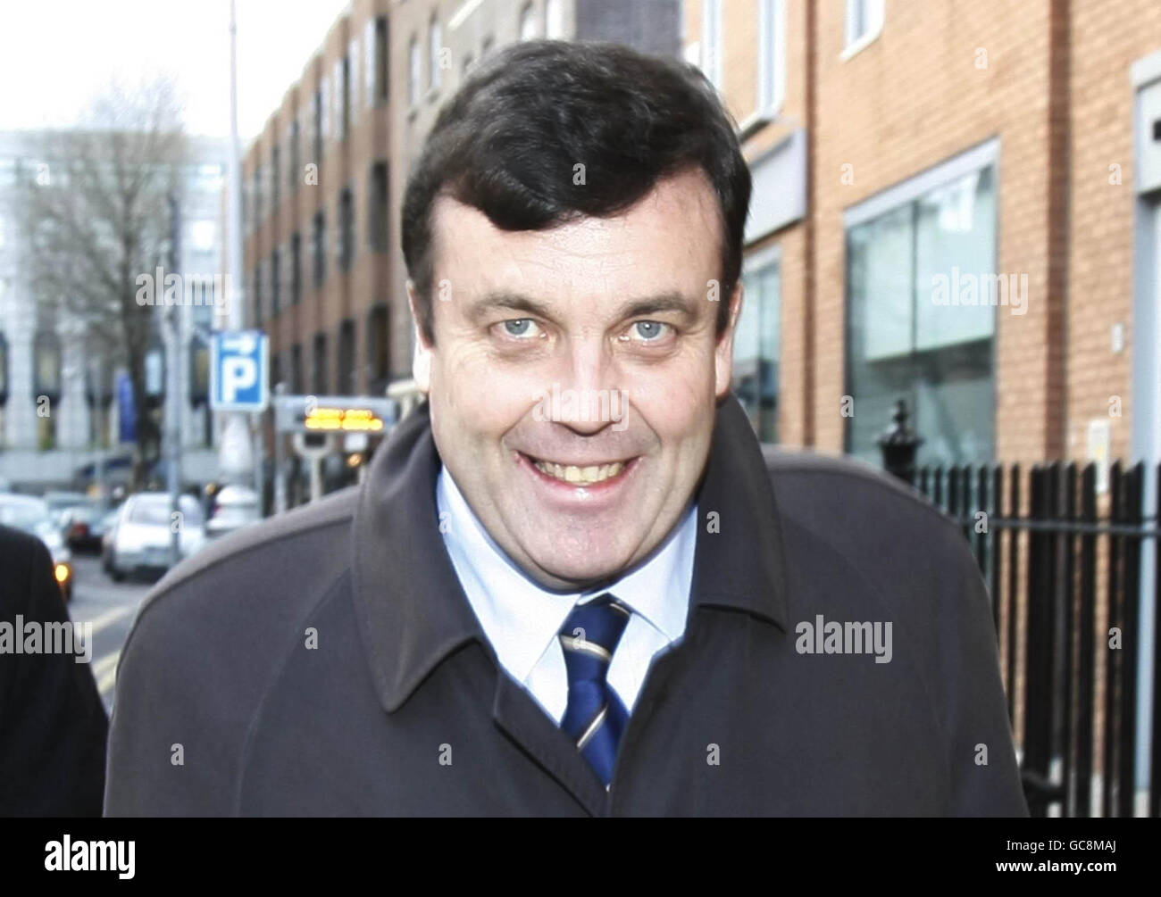 Finance Minister Brian Lenihan walks along Molesworth Street in Dublin after briefing the media on his medical condition. Lenihan confirmed he would undergo treatment to remove cancerous tissue in his pancreas. Stock Photo