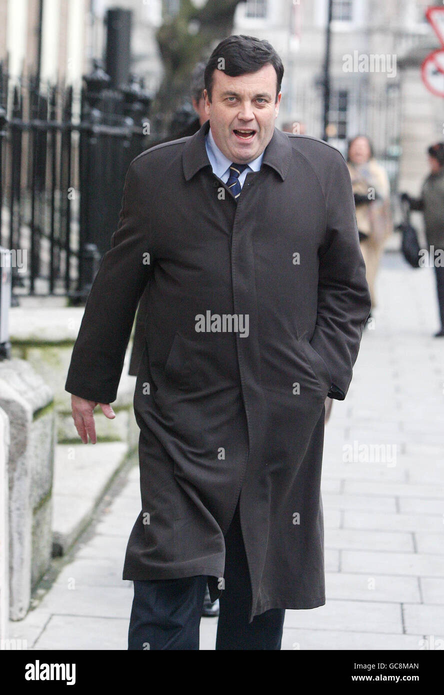 Finance Minister Brian Lenihan walks along Molesworth Street in Dublin after briefing the media on his medical condition. Lenihan confirmed he would undergo treatment to remove cancerous tissue in his pancreas. Stock Photo