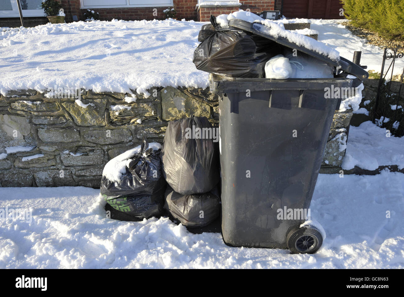 Full wheelie bins line the streets in Brislington, Bristol, where
