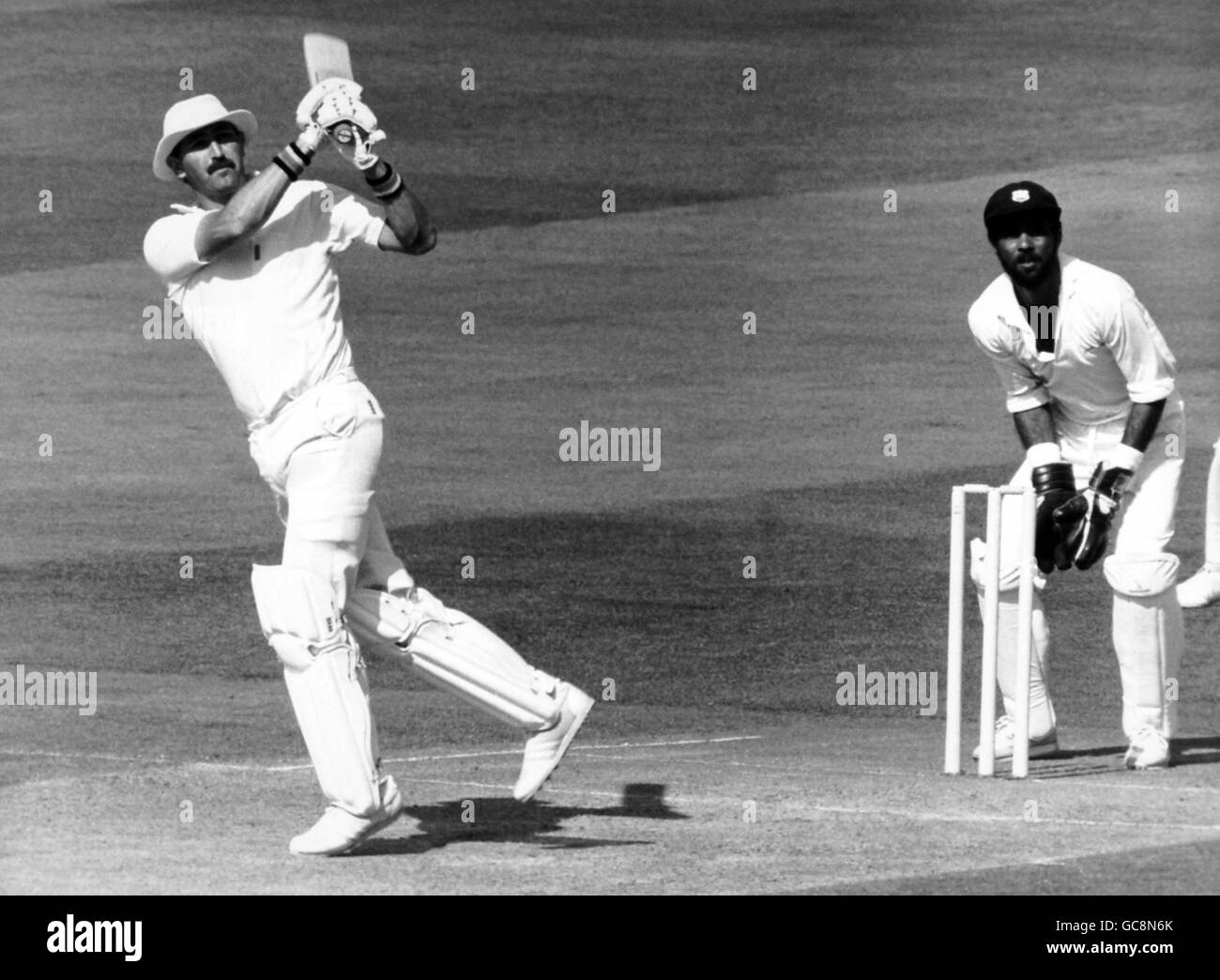 Cricket - Marylebone Cricket Club v Rest of the World XI - Rest of the World XI in England 1987 -Venue Lord's Cricket Ground,... Graham Gooch hits a four for the MCC team, off West Indian bowler Roger Harper, oh his way to a century in the MCC Bicentenary Match Stock Photo