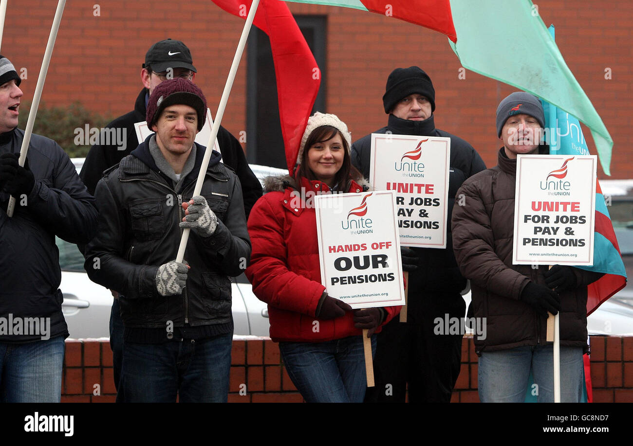 Workers stand outside the Fujitsu offices on the Holywood road in Belfast, where they are striking against proposals for redundancies, a pay freeze and plans by the company to close the main final salary pension scheme to new workers. Stock Photo
