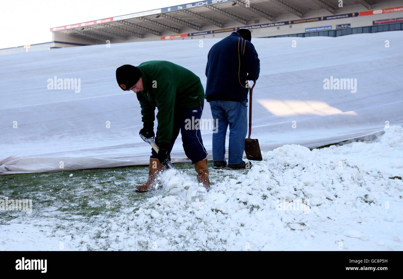 Groundstaff clear snow at Worcester Warriors home ground, Sixways Stadium. Stock Photo