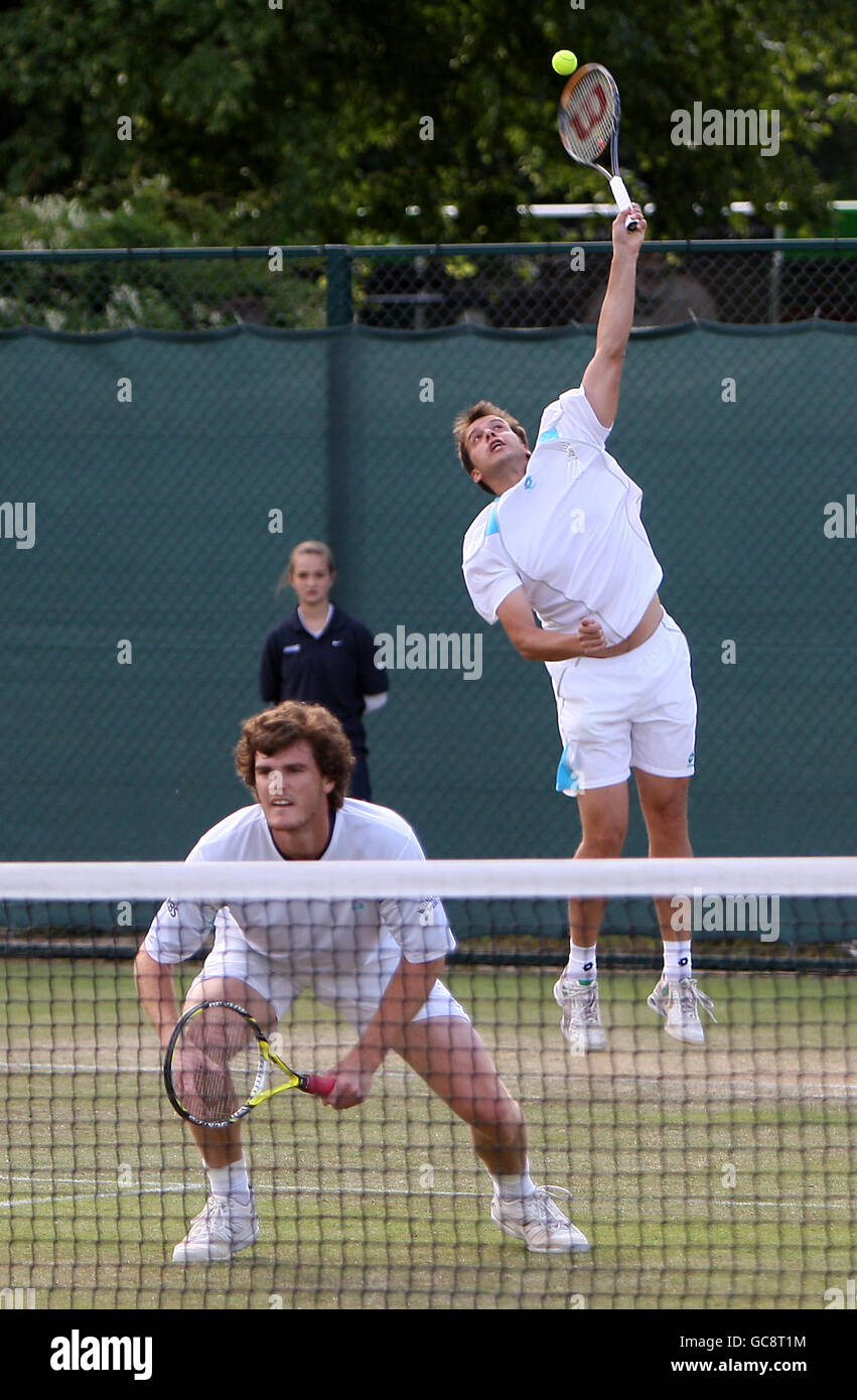 Luxemburg's Gilles Mullern (back) serves during his doubles match with partner Great Britain's Jamie Murray against USA's Robert Kendrick and Jesse Levine (not pictured) Stock Photo