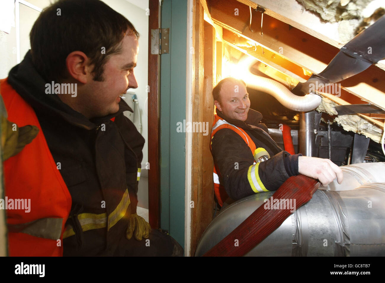 (left to right) Niall McGavin and Declan Barry of the Dublin Civil Defence, refills the water tanks at the Capuchin Day centre for homeless people in Dublin as properties in Dublin experience water shortages. Stock Photo