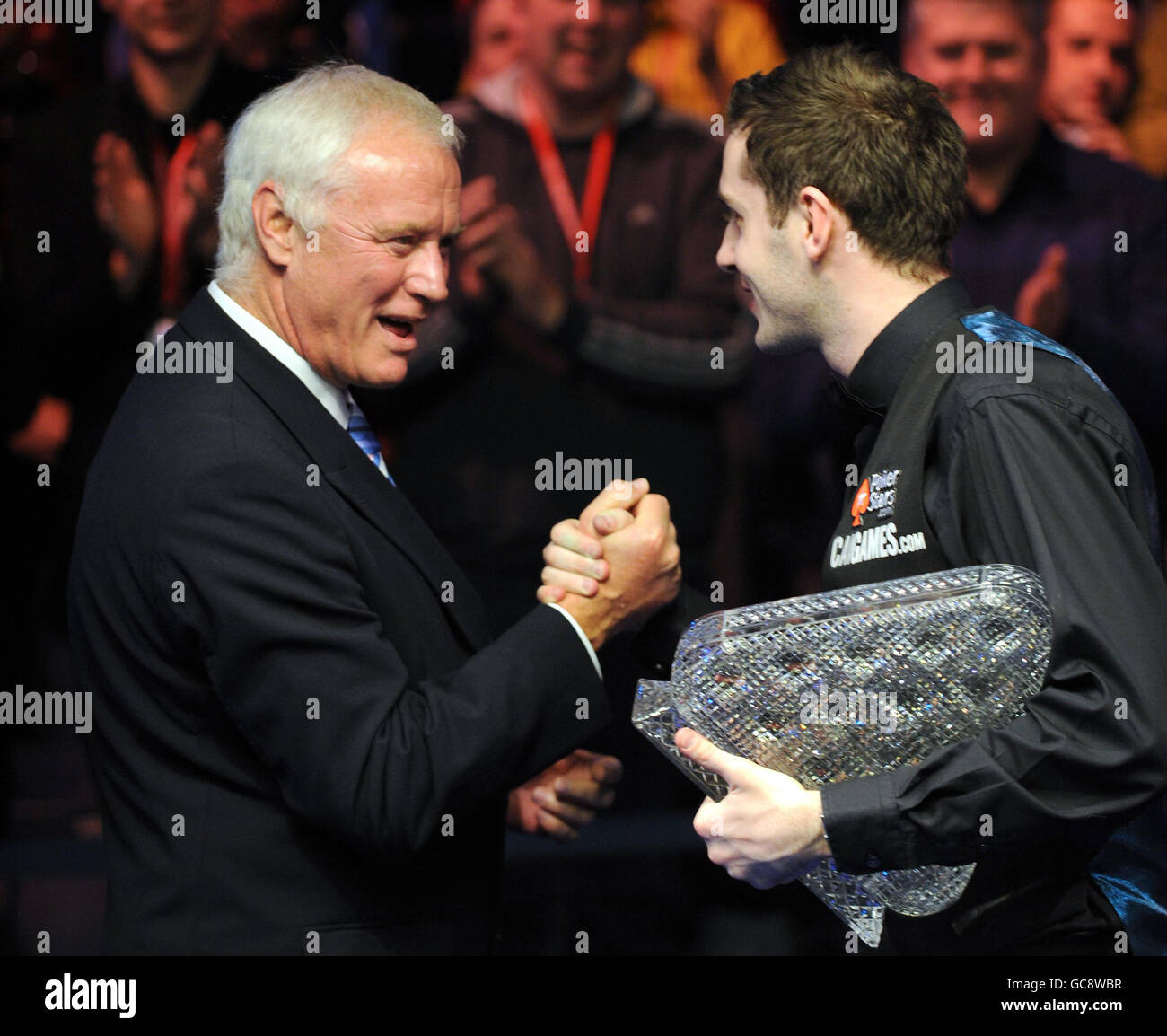 Snooker - The Pokerstars.com Masters 2010 - Day Eight - Wembley Arena. Mark Selby is congratulated by Barry Hearn after beating Ronnie O'Sullivan in the Final of The Masters at Wembley Arena, London. Stock Photo