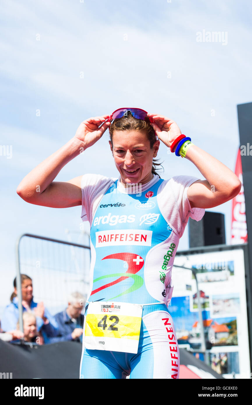 Nicola Spirig, a professional triathlete from Switzerland, wins the women's Ironman 70.3 Norway Triathlon in Haugesund with a final time of 04:09:37. Stock Photo