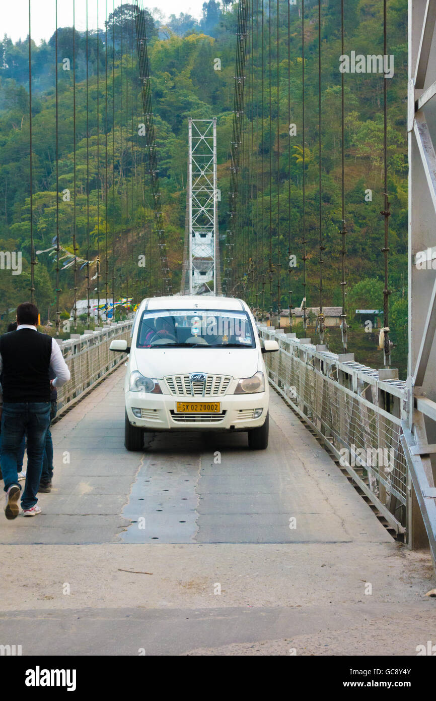 Mahindra Xylo vehicle on Singshore Suspension Bridge at Pelling, Sikkim, India Stock Photo